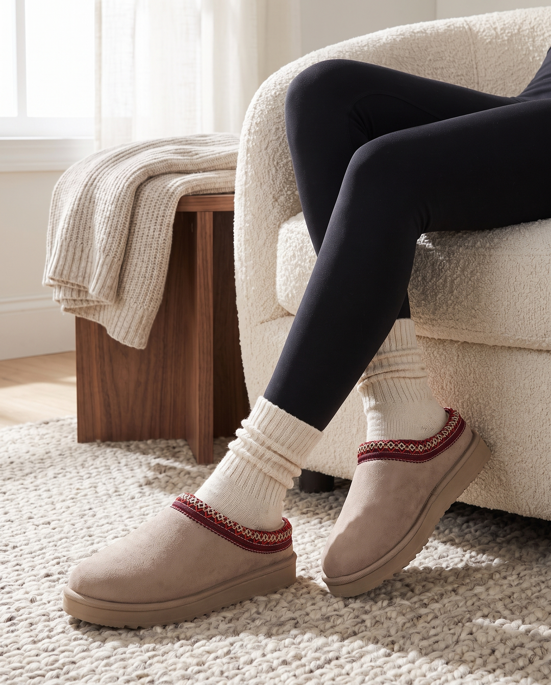 Apricot slippers styled with black leggings and cozy socks at home